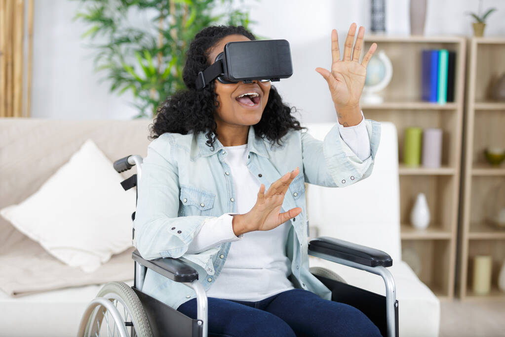 Woman playing VR in a wheelchair