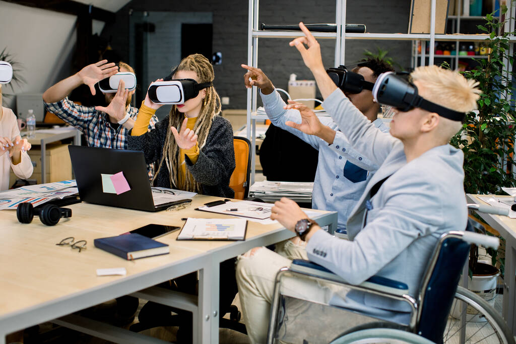 Group of people playing VR while seated in wheelchairs