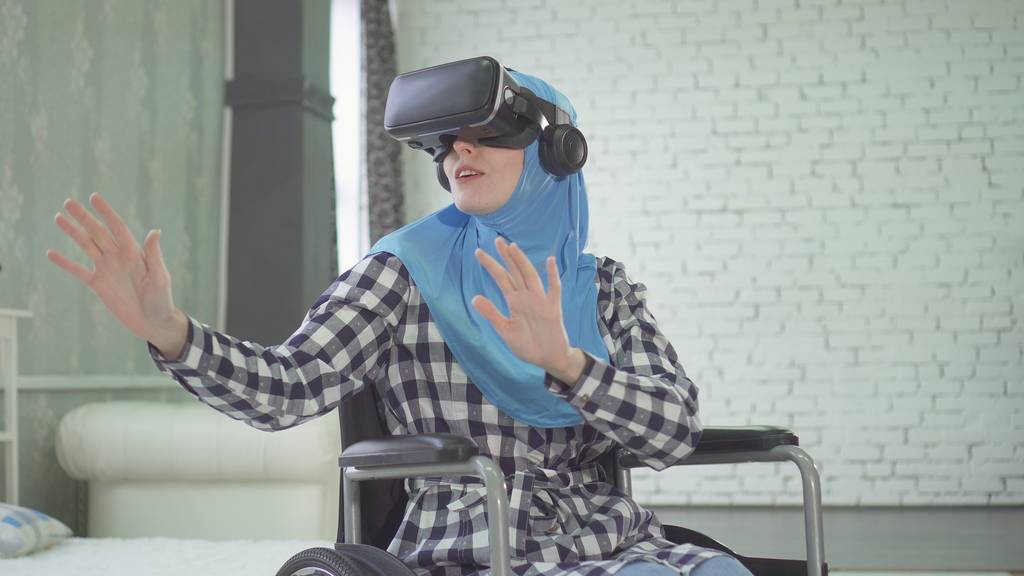 Woman playing VR in a wheelchair