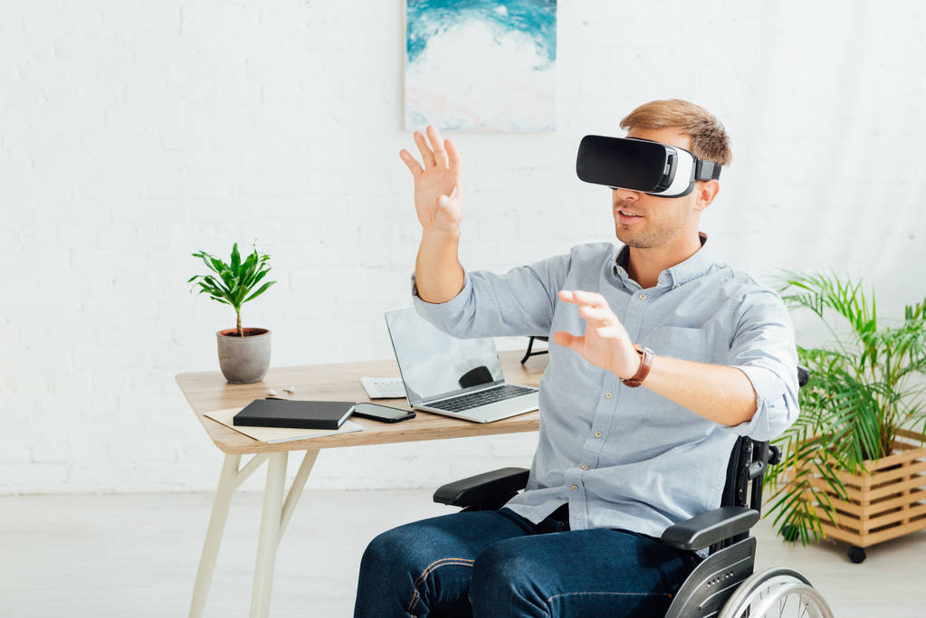 Man playing VR in a wheelchair