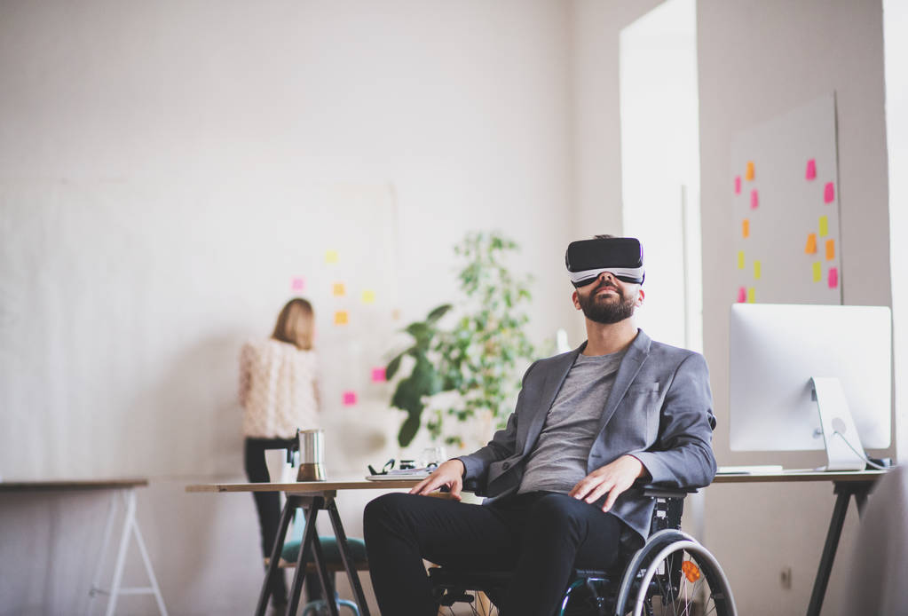 Man playing VR in a wheelchair